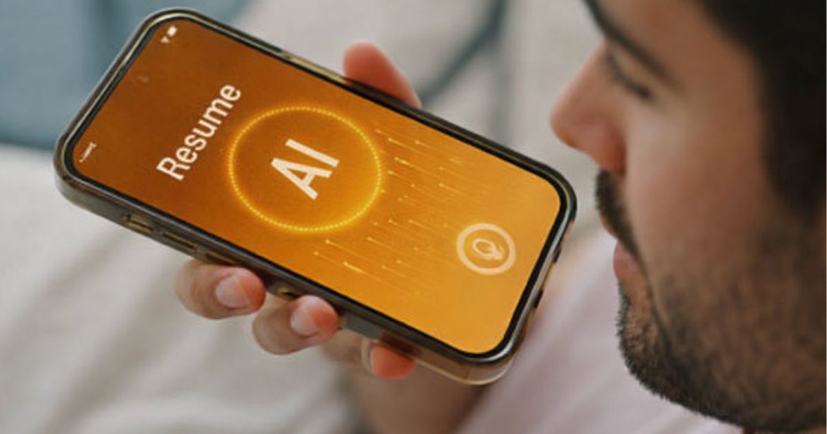Man using AI resume builder app on smartphone with amber interface showing resume creation screen