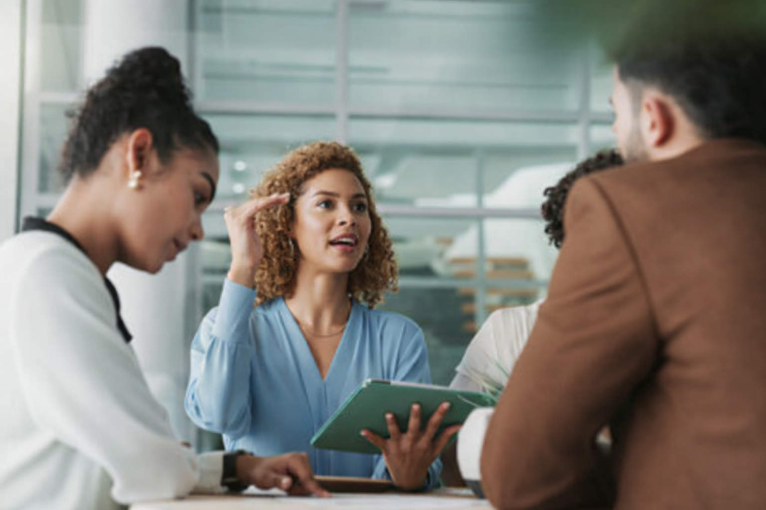 Justice-involved individual using a laptop in a community reentry center, receiving digital employment and reintegration support through AI-powered workforce tools.